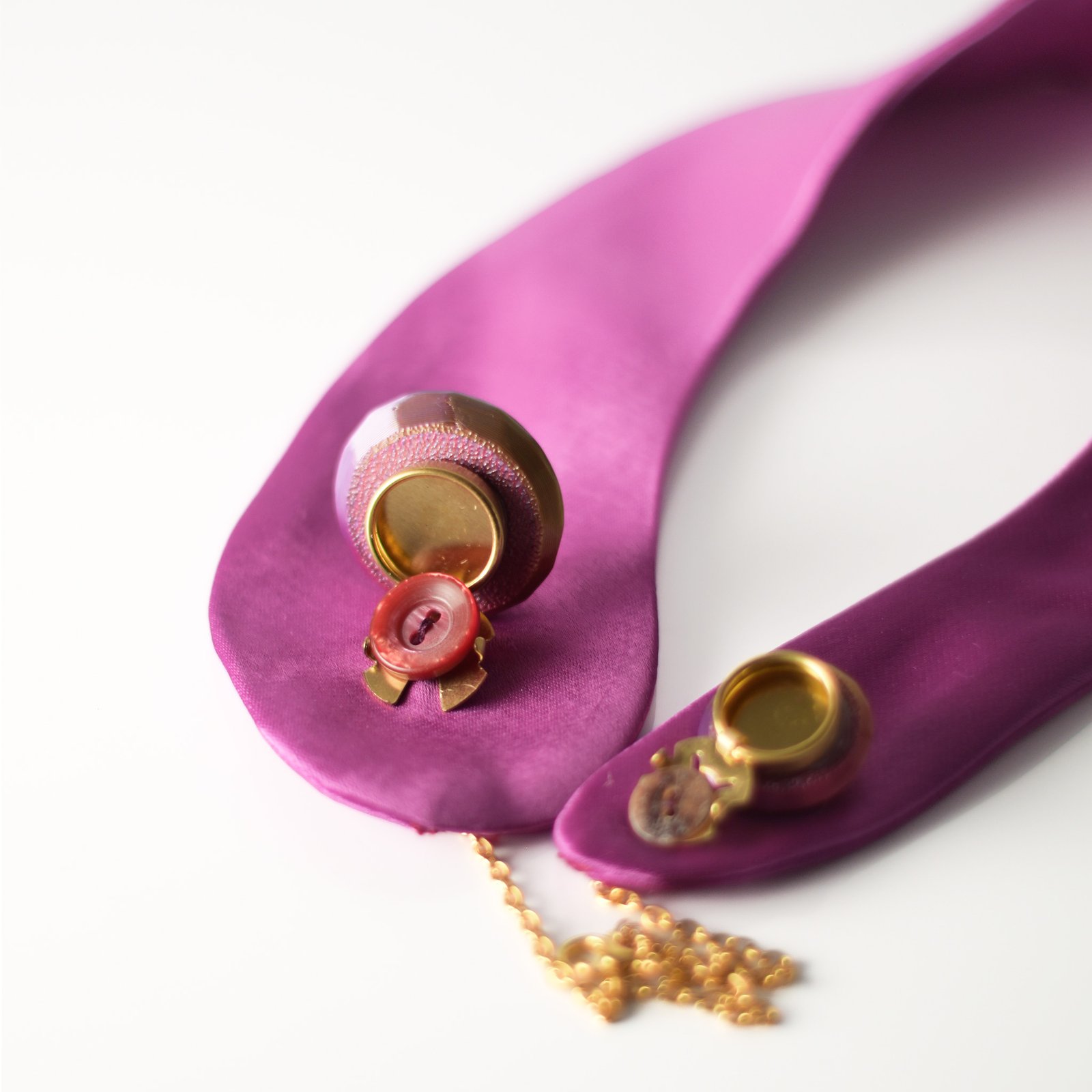Violet half moon button cover on satin fabric