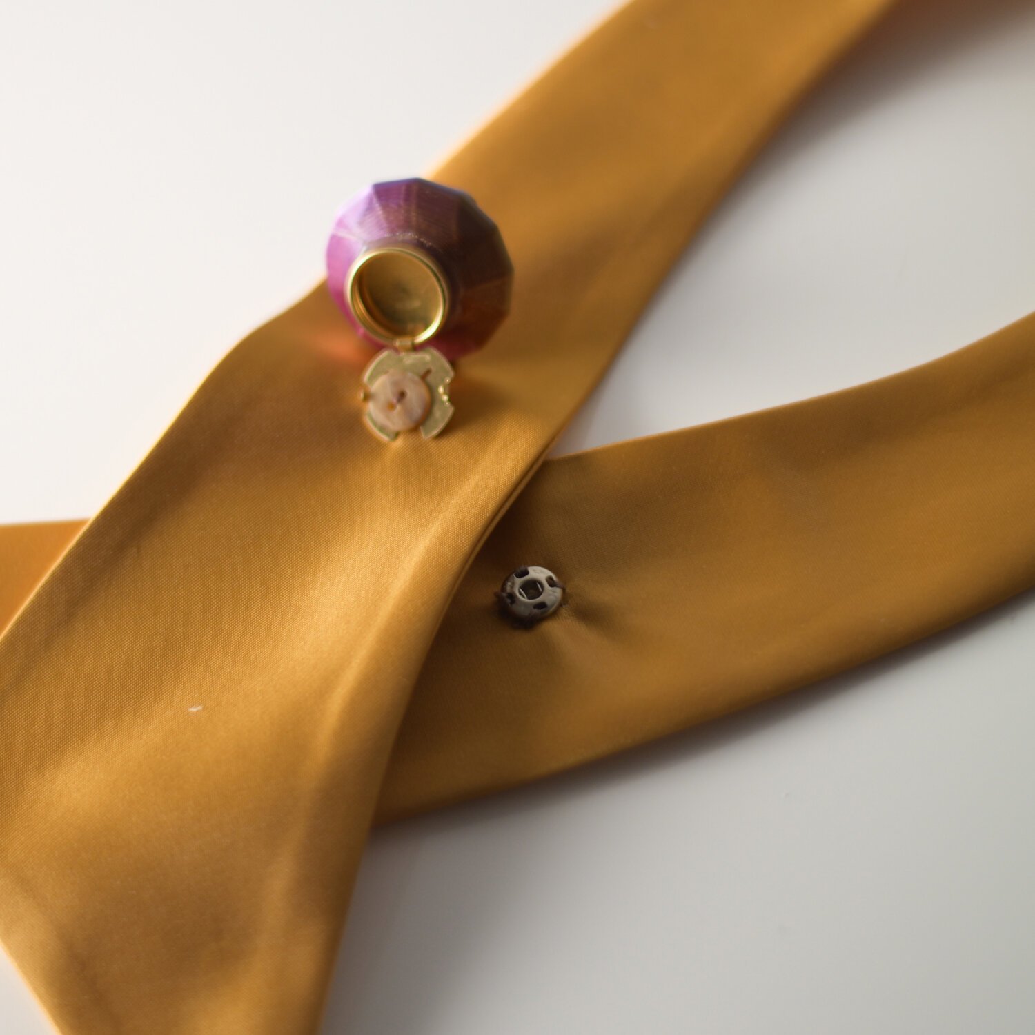Violet cup button cover on satin fabric